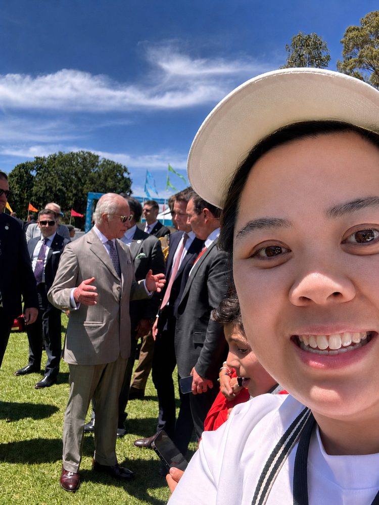 Jackie from Rice Pantry with HM King Charles III behind