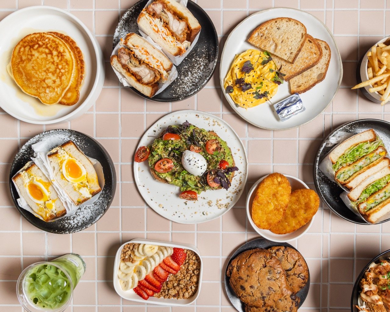 A spread of Pantori Café & Bakery brunch dishes — pancakes, katsu sando, avocado toast and more